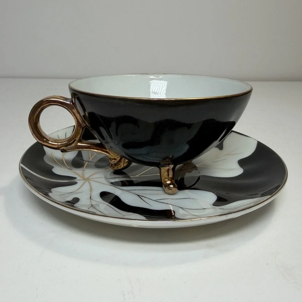 Footed Tea Cup and Saucer Black White Gold Leaf MCM Holywood Regency Art Deco